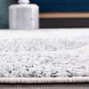 SAFAVIEH Madison Collection Area Rug – 5’3″ x 7’6″, Creme & Yellow, Glam Ogee Trellis Distressed Design, Non-Shedding & Easy Care, Ideal for High Traffic Areas in Living Room, Bedroom (MAD604C)(Ivory/Blue)