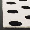 SAFAVIEH Kids Collection Area Rug – 5′ x 7′, Ivory & Black, Handmade Polka Dot Wool, Ideal for High Traffic Areas in Living Room, Bedroom (SFK904D)(Ivory/Black)