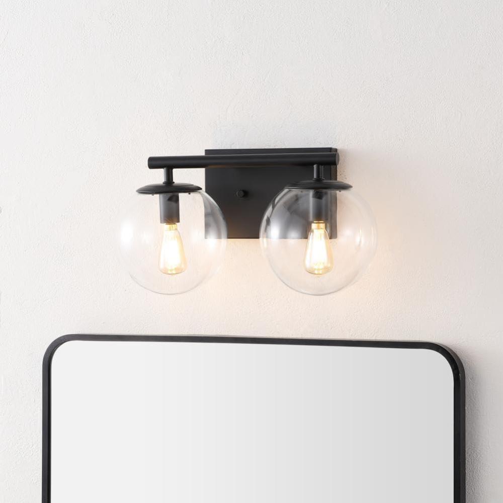 image:imageSAFAVIEH Lighting Collection Severa BrassClear Glass Globe Shade 2Light Wall Sconce Light Fixture Ideal for Bathroom Entryway Vanity Foyer Hallway Living Room LED Bulb IncludedBlack
