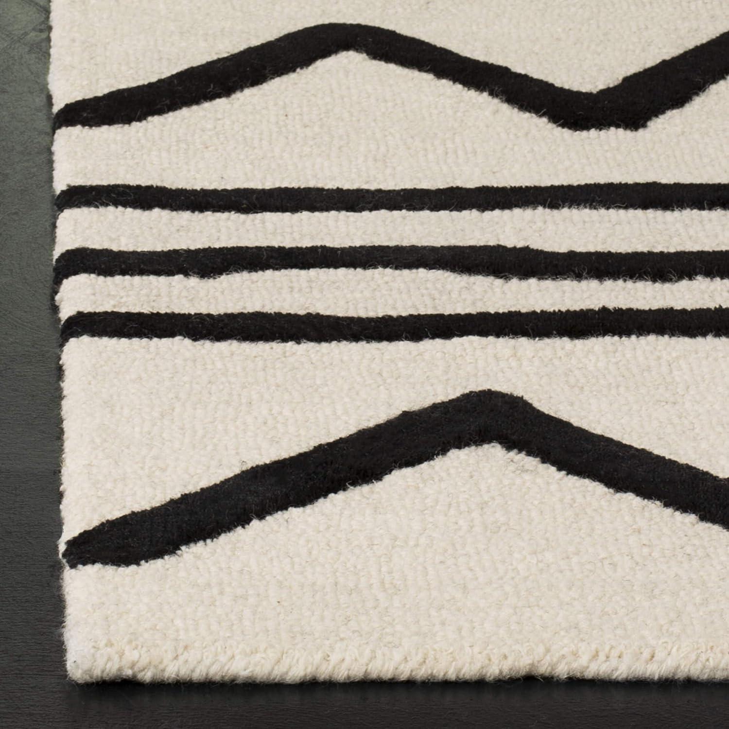image:imageSAFAVIEH Kids Collection Area Rug 5 x 7 Navy amp Ivory Handmade Moroccan Wool Ideal for High Traffic Areas in Living Room Bedroom SFK907NIvoryBlack