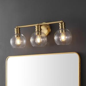 SAFAVIEH Lighting Collection Sunetta Black/Clear Glass Globe Shade 3-Light Wall Sconce Light Fixture, Ideal for Bathroom, Entryway, Vanity Over Mirror, Foyer, Living Room (LED Bulbs Included)(Brass)
