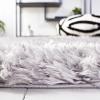 SAFAVIEH Flokati Shag Collection Area Rug – 6’7″ x 9′, Beige, Solid Design, Non-Shedding & Easy Care, 2.75-inch Thick Ideal for High Traffic Areas in Living Room, Bedroom (FLK950E)(Silver)