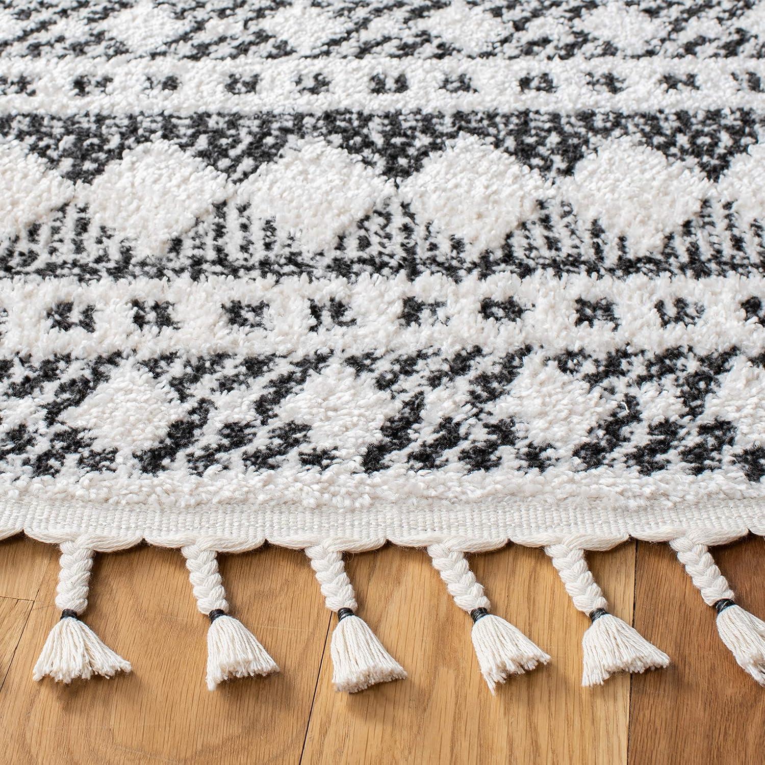 image:imageSAFAVIEH Moroccan Tassel Shag Collection Area Rug 55 x 77 Ivory amp Light Blue 075inch Thick Ideal for High Traffic Areas in Living Room Bedroom MTS484CIvoryBlack