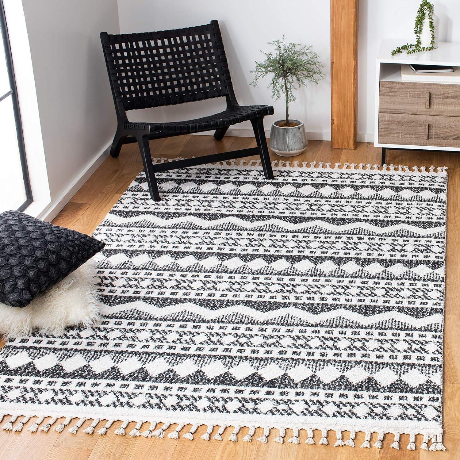 image:imageSAFAVIEH Moroccan Tassel Shag Collection Area Rug 55 x 77 Ivory amp Light Blue 075inch Thick Ideal for High Traffic Areas in Living Room Bedroom MTS484CIvoryBlack
