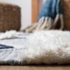 SAFAVIEH Natura Collection Accent Rug – 4′ x 6′, Ivory & Blue, Handmade Moroccan Boho Tassel Wool, Ideal for High Traffic Areas in Entryway, Living Room, Bedroom (NAT678A)(Ivory/Blue)