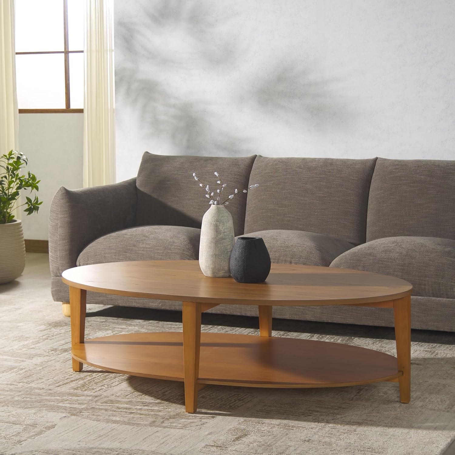 image:imageSAFAVIEH Couture Collection Leonardi Black Oval Coffee TableNatural