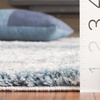 SAFAVIEH Berber Shag Collection Area Rug – 9′ x 12′, Ivory & Blue, Abstract Design, Non-Shedding & Easy Care, 1.2-inch Thick, Ideal for the Living Room, Dining, Bedroom (BER586M)(Ivory/Blue)