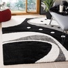 SAFAVIEH Florida Shag Collection Area Rug – 8’6″ x 12′, Dark Blue & Ivory, Abstract Design, Non-Shedding & Easy Care, 1.2-inch Thick Ideal for High Traffic Areas in Living Room, Bedroom (SG473-6511)(Black/Ivory)