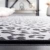 SAFAVIEH Washable Rug Faux Hide Collection – 5′ x 8′, Ivory & Black, Slip Resistant, Printed Leopard Pattern, Ideal for Living Room, Bedroom, Home Office, Dining Space (FAH505A)(Ivory/Black)